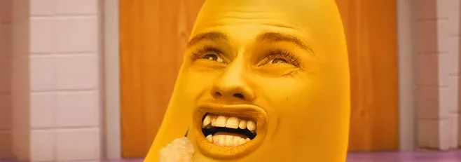 A banana with a human face with a confused expression