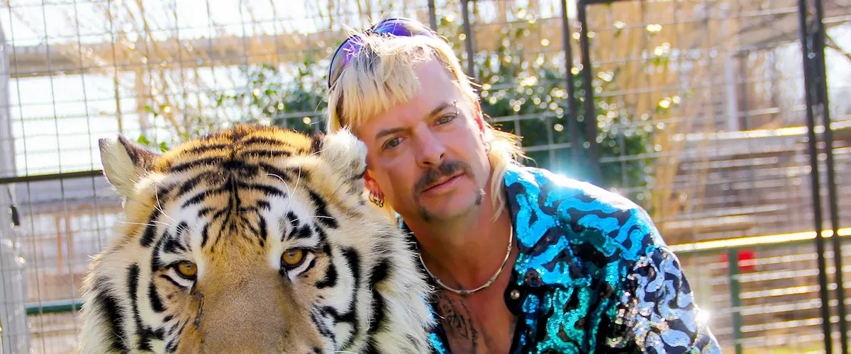An extragavant guy with a tiger